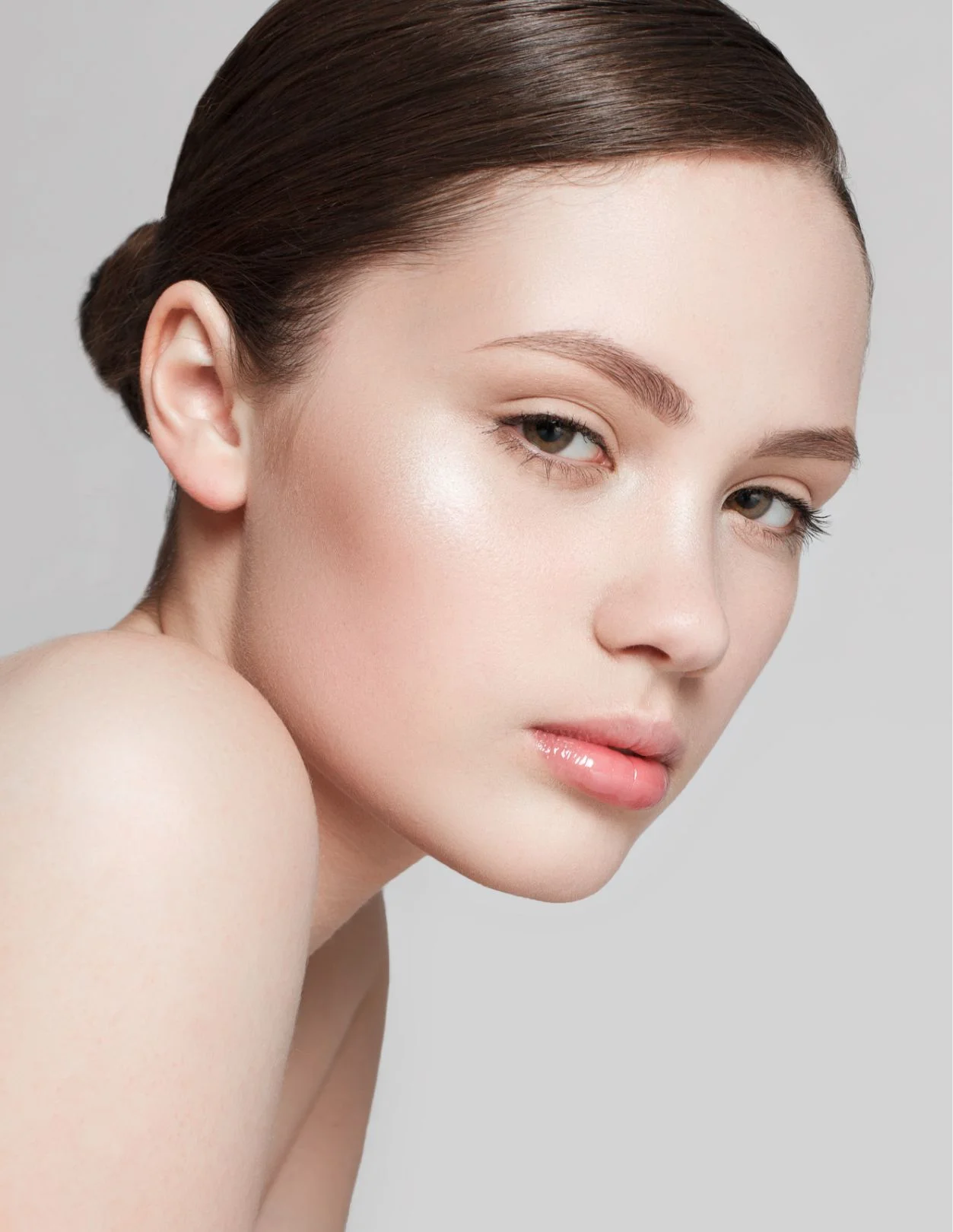 a young woman in profile on a white background