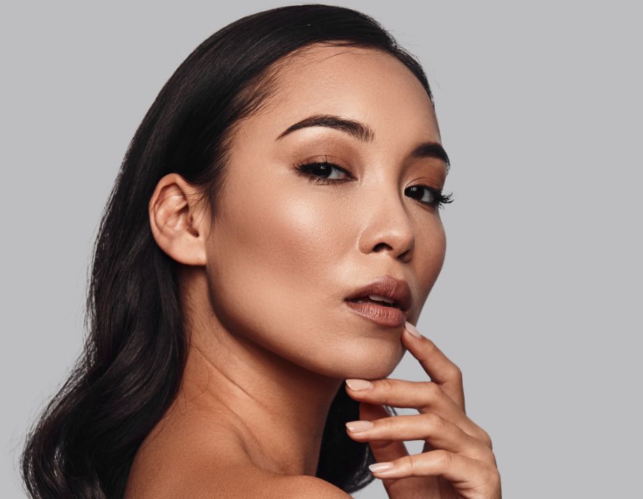 young woman touching her chin with her hand